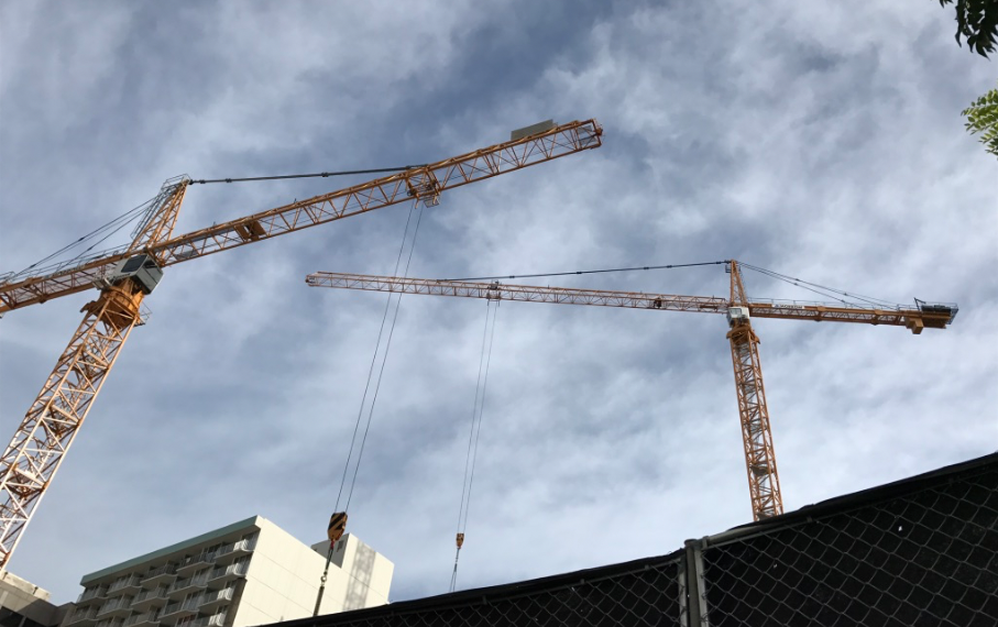 two construction cranes in Honolulu