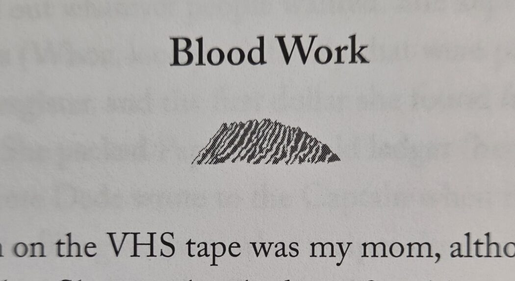 Photo of the title of the short story "Blood Work" and its visual accompaniment: A mountain ridge. Part of Koʻolau
